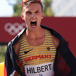 Olympic runner Jonathan Hilbert mid-race