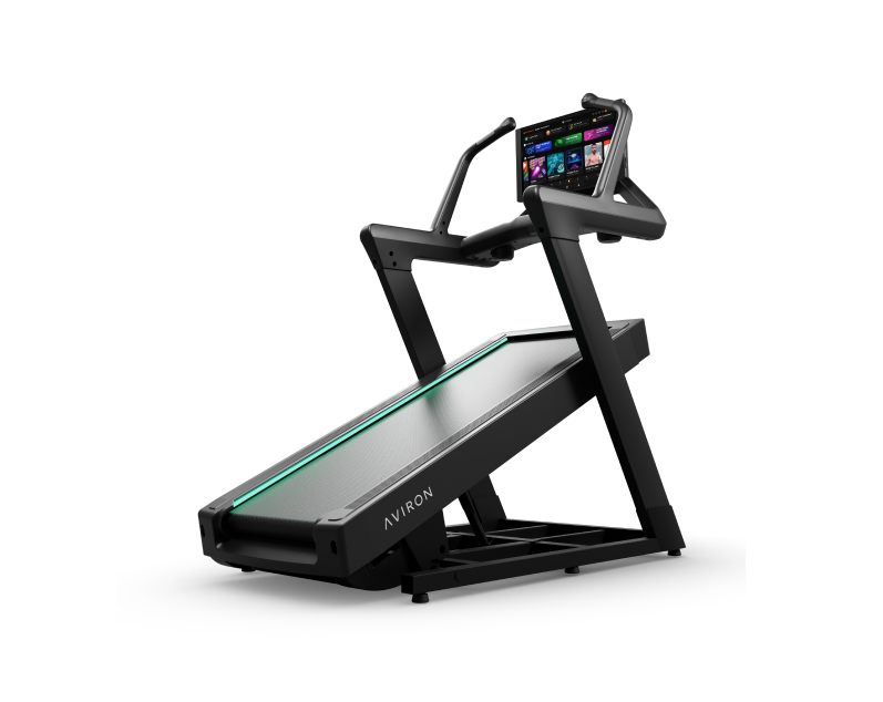Aviron Summit incline trainer at a steep incline with hiking handles and LED belt strip